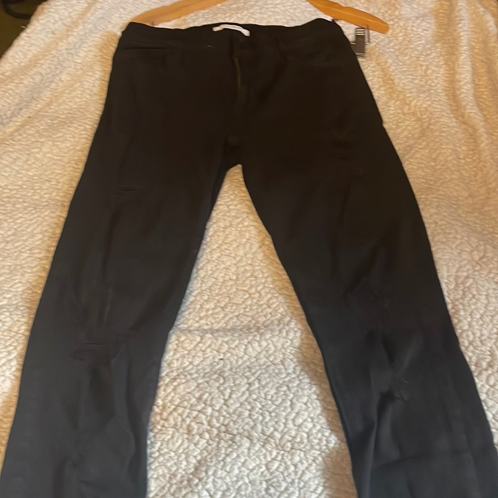 Pacific Sunwear lightly distressed jeggings. Size 28. Black.